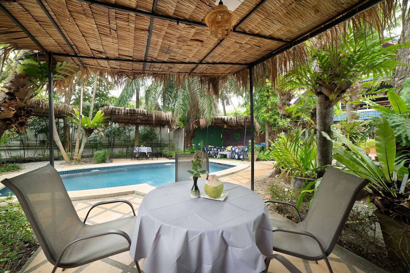 Dining, Pool & Suite at The Nai Harn Collective boutique villa hotel in Phuket - Wake up to breathtaking pool vistas. This suite offers spacious living and unparalleled scenery.