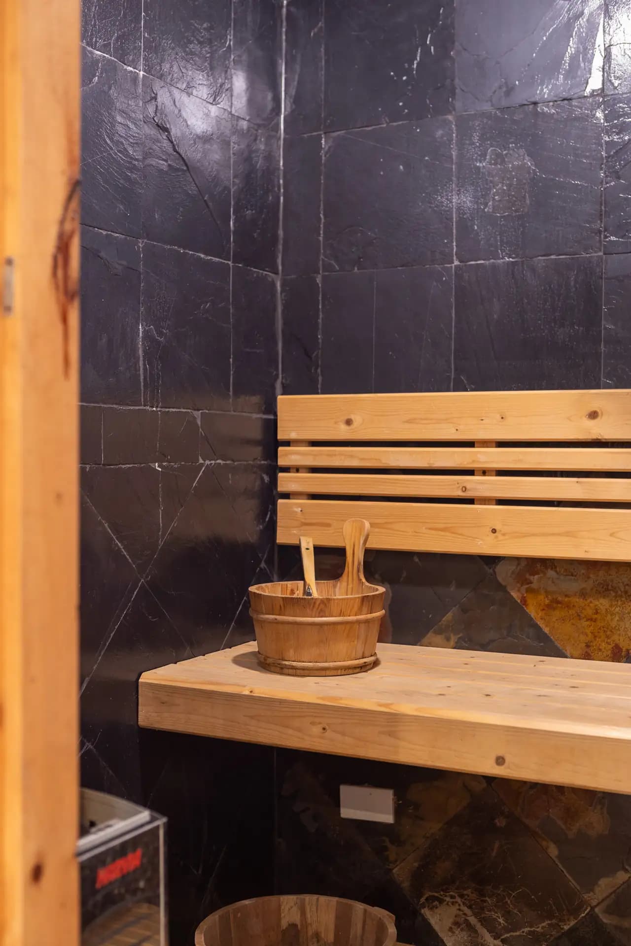 Sauna facility at The Nai Harn Collective boutique villa hotel in Phuket - Relax in our traditional sauna, designed to promote detoxification and stress relief through gentle heat therapy.